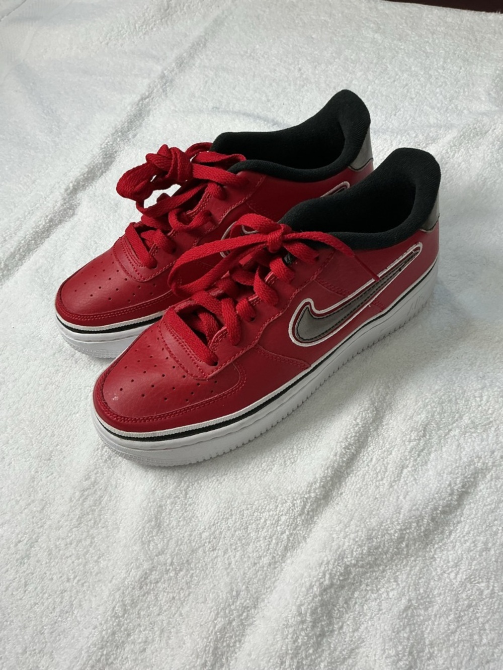 Nike Red Low-Top Sneakers with Black Lining and White Sole